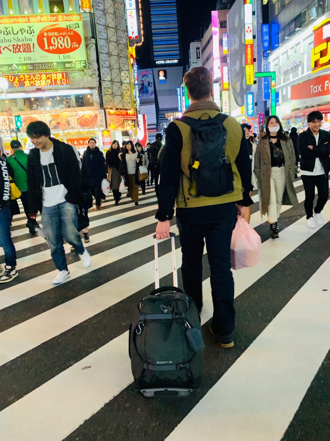 Luke walking down streets of Tokyo Japane