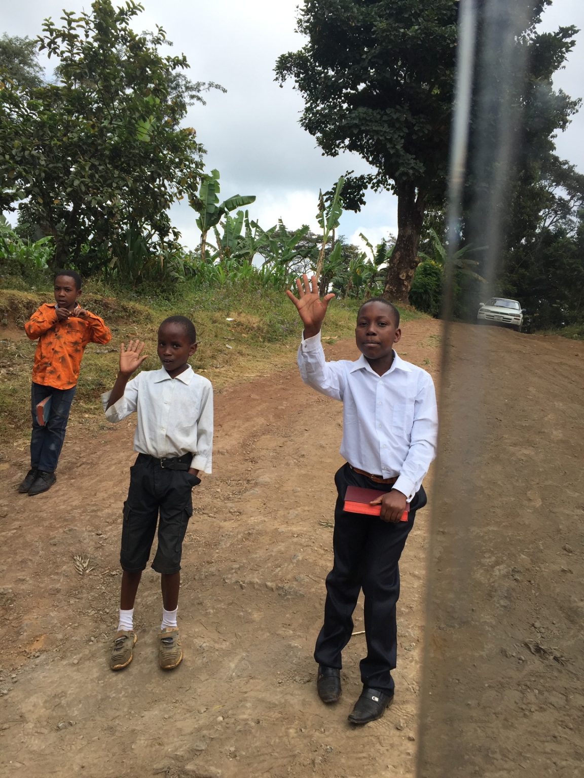 kids waving in Tanzania, Africa