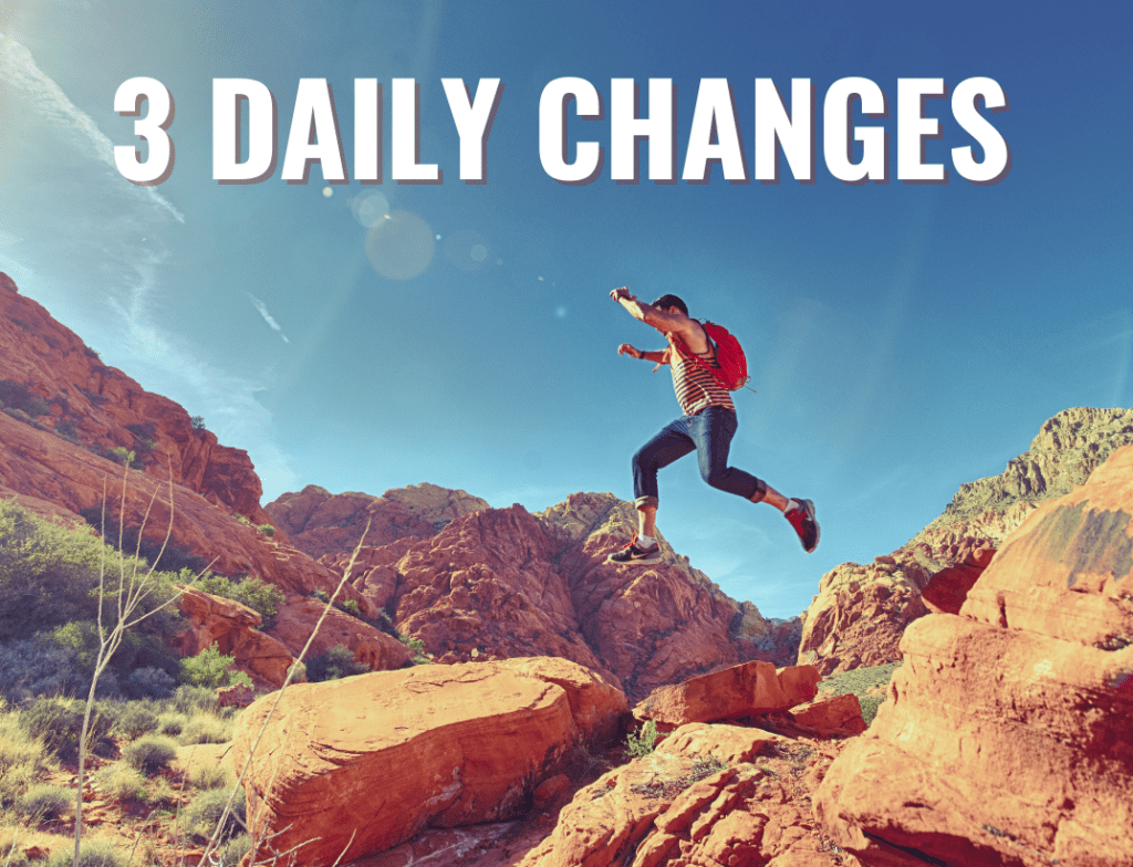 Man jumping across canyon in dessert on adventure