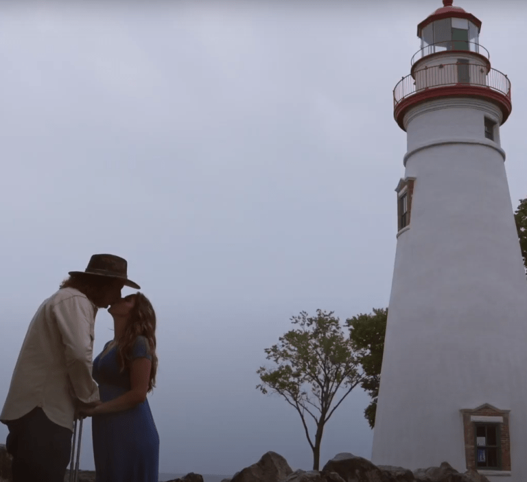 Luke and Sam Kuhn at lighthouse in Marblehead, Ohio, for pregnancy announcement video