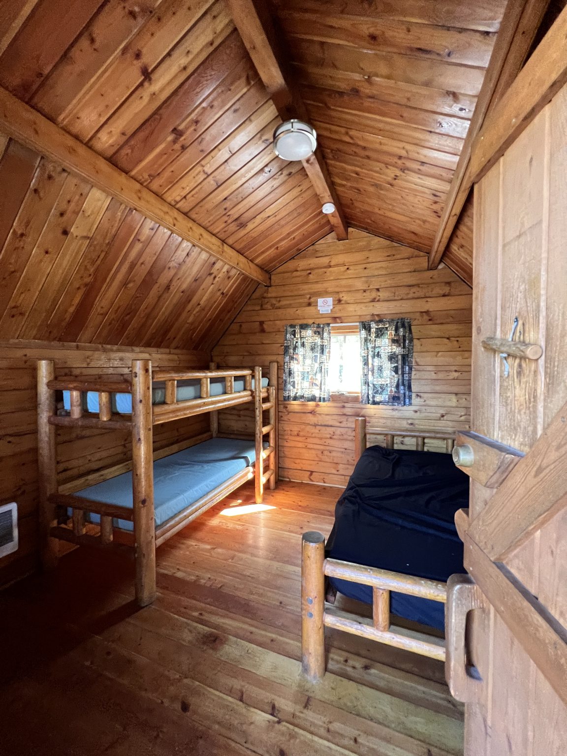 The inside of a KOA log cabin.